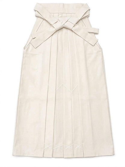 May include: Cream-colored hakama, a traditional Japanese garment, with a pleated design. The hakama features a large bow at the back and decorative stitching. The fabric appears to be a soft, matte material.